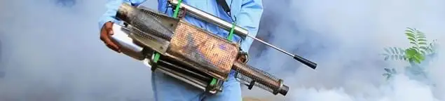 Fumigation technician using a fogger for deep pest treatment in Allentown, PA