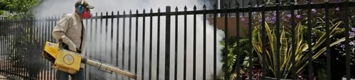 Mosquito control technician fogging a yard perimeter for mosquito reduction in Allentown, PA